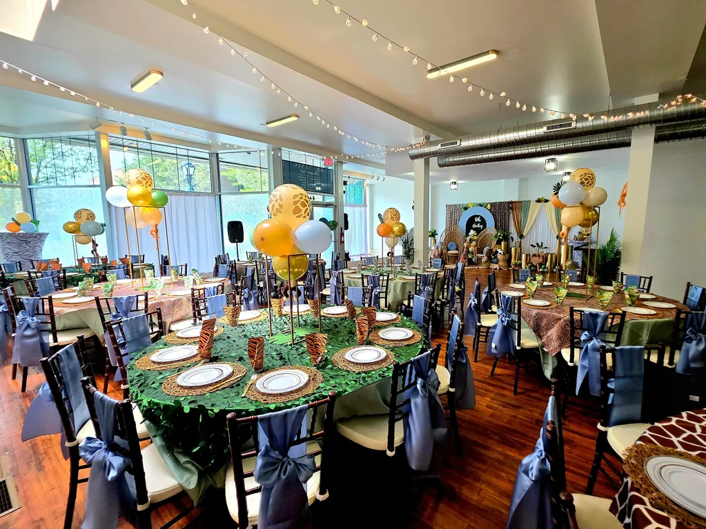 Decorated celebration table with balloons and themed details